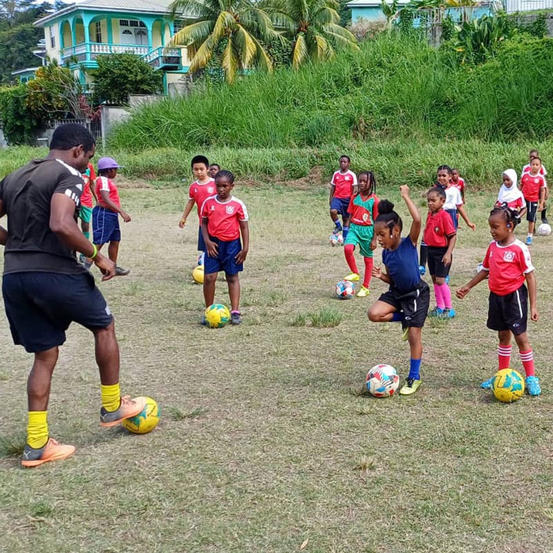 Coach George demonstrating how a drill is done