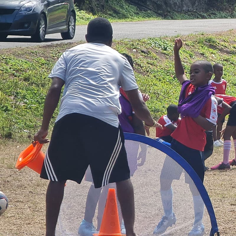 Coach George getting our youth players ready for a practice match