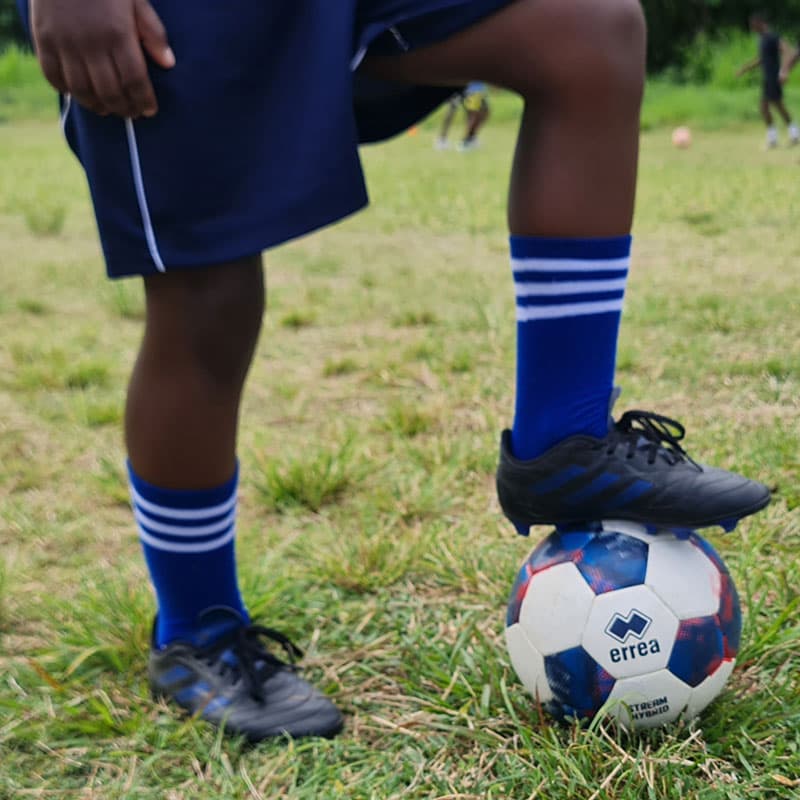 A player with his foot on a ball